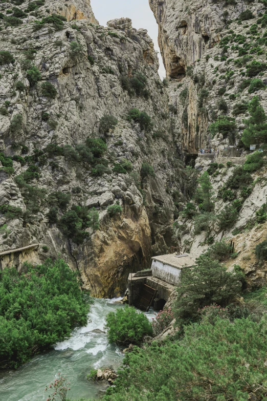 the trail passes through an outcropping canyon