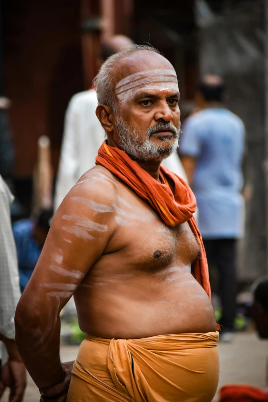 the man in his brown pants has very thick tusks