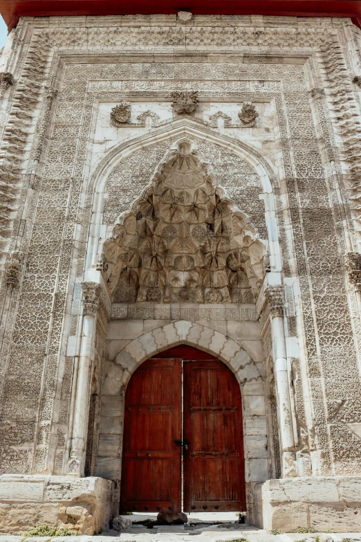 red and white gate with the words on top of it