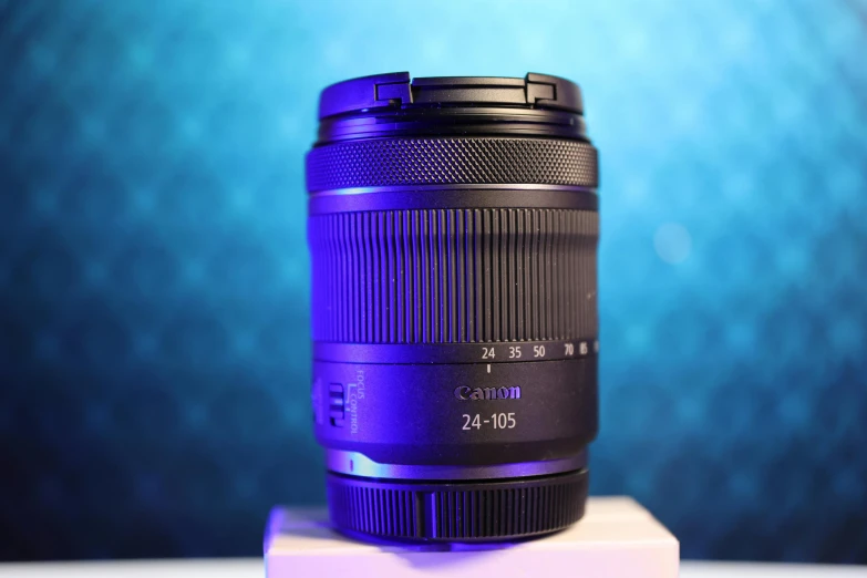 a blue lens sitting on top of a white pedestal