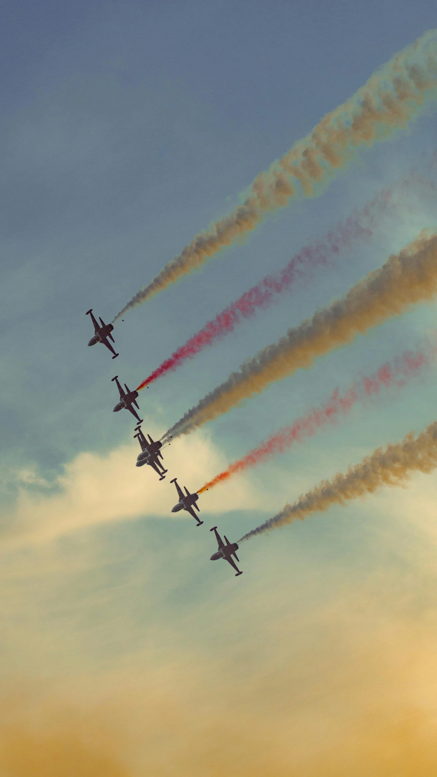 a group of airplanes flying through the air