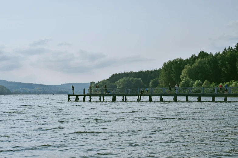 a pier over looking some water and trees