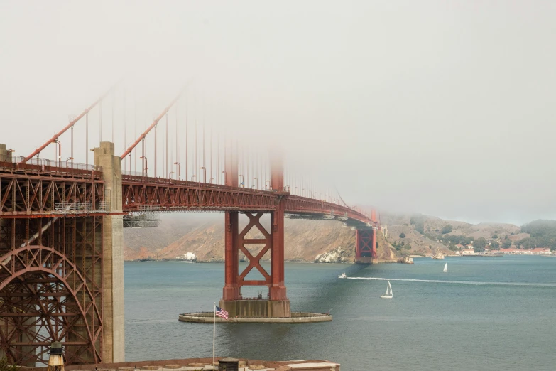 this is the golden gate bridge seen on a foggy day