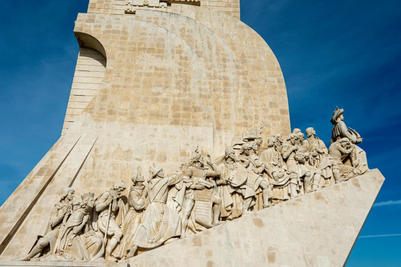 the monument has a tall clock tower with statues