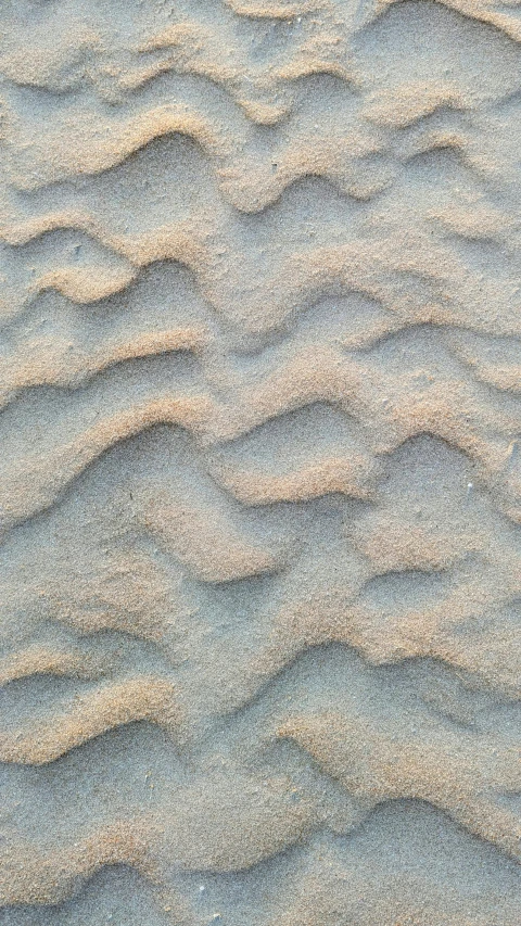 a close up view of sand in the sand