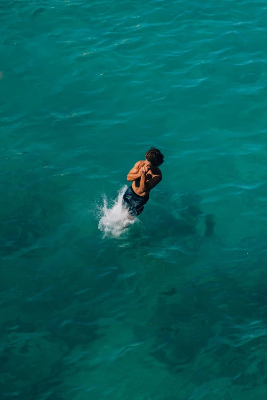 a man riding a surf board in the ocean