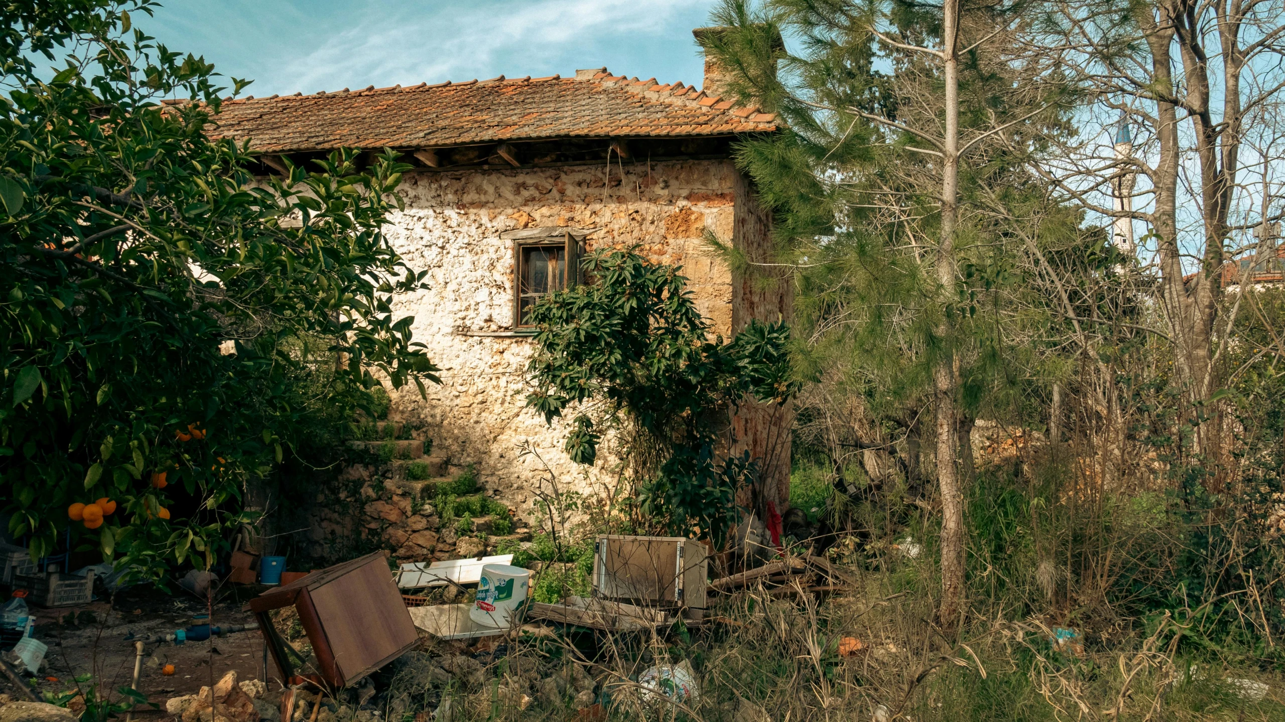 an old building sitting next to some trees