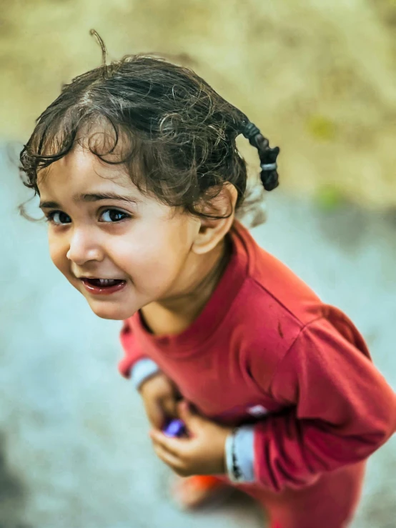 an adorable little girl with a big smile