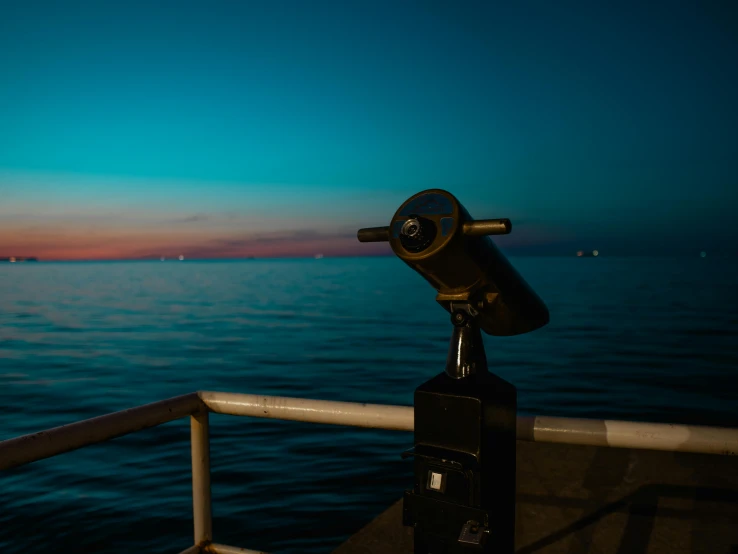 an telescope set to look out over a body of water