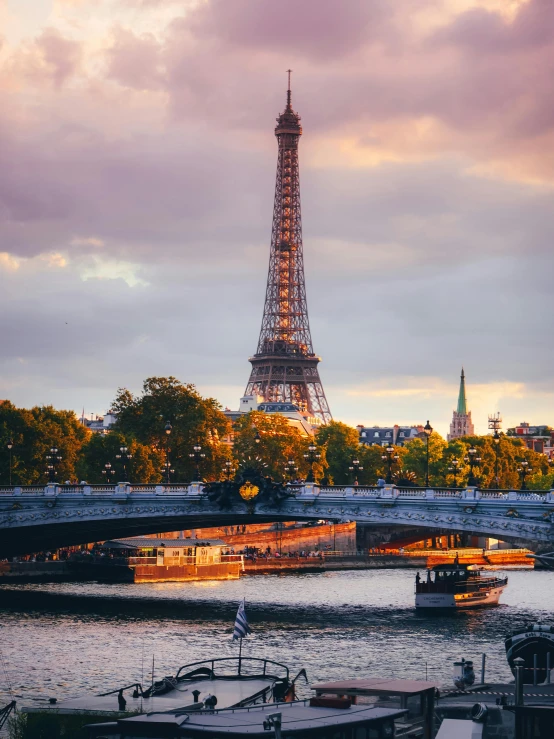 eiffel tower towering over the city at sunset