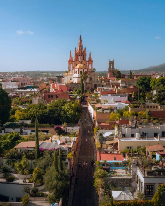 this is an aerial view of a city with a tall church