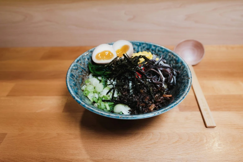 a bowl of different foods is on the table