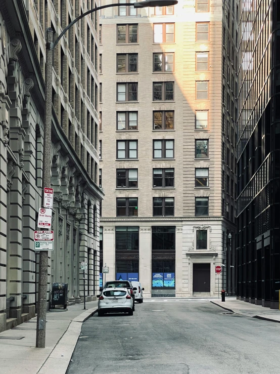 an empty street between two large buildings