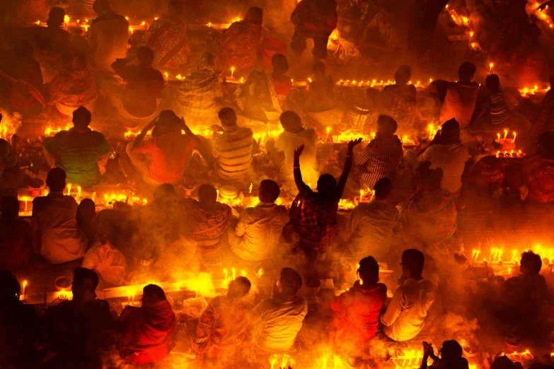 people are lit by candles at a religious event