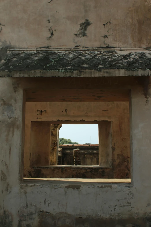 an open window on the side of a wall