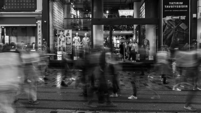 this is a po of people walking on the street outside