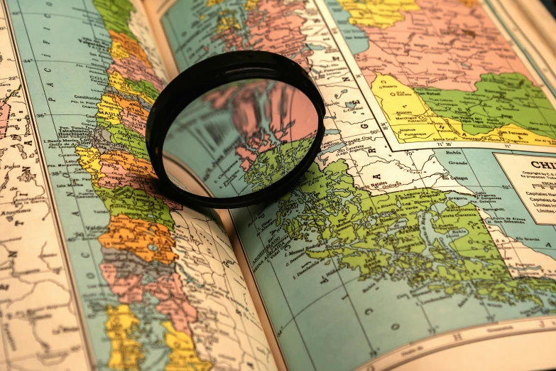 a close - up of a magnifying glass looking down on a map of england