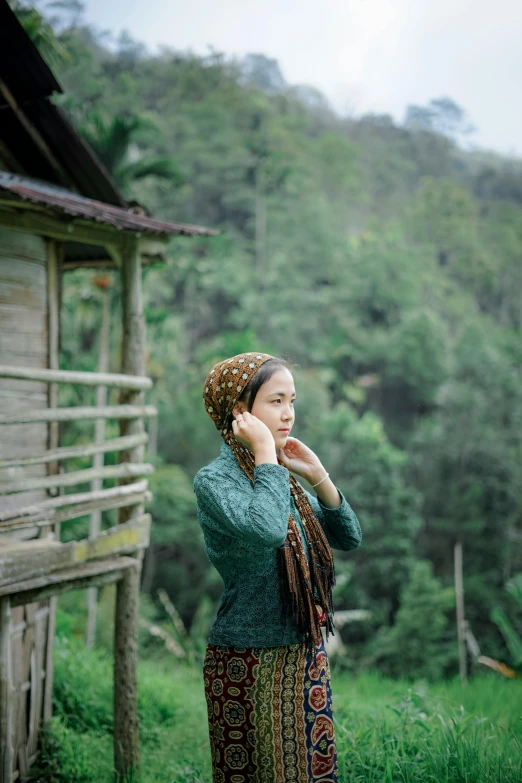 a woman wearing a head wrap on her head