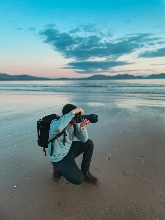 a person taking a po of the water with a camera