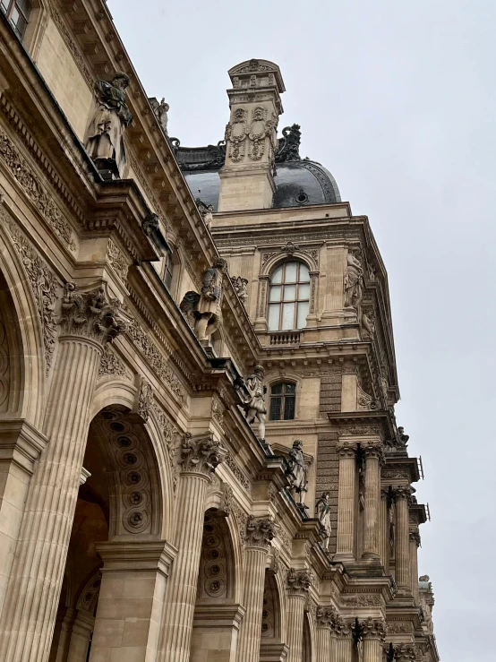 a tall building with several windows and an ornate design