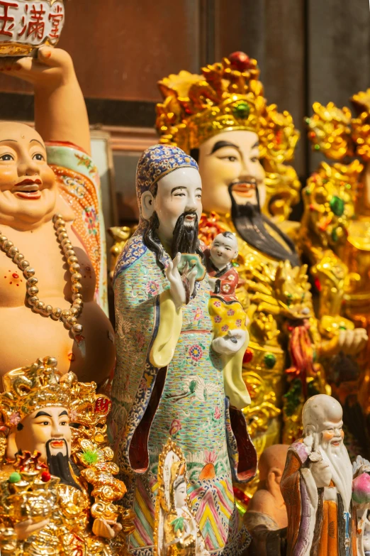 some figurines are displayed and people in costume