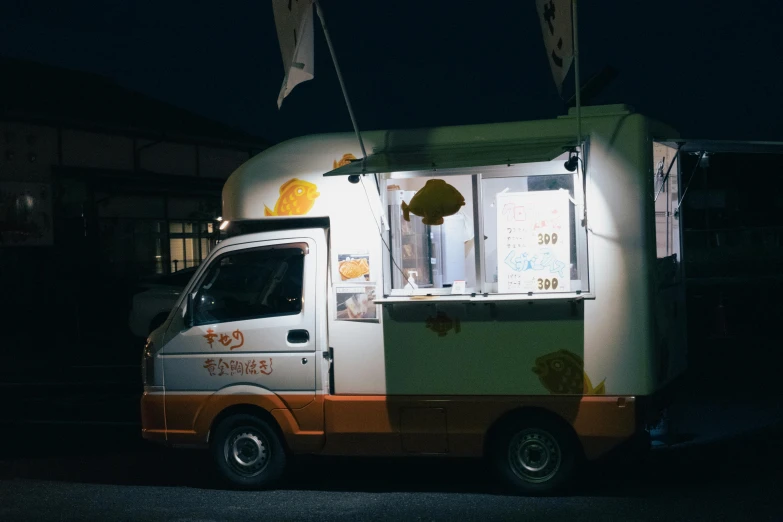 a food cart parked next to a building with flags