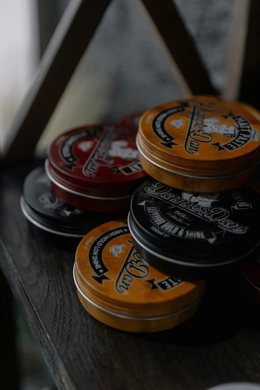 four beer coasters sitting on a table next to a lamp