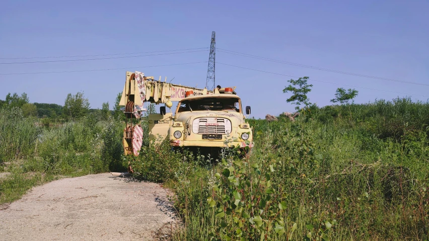 a tractor sits on the side of the road