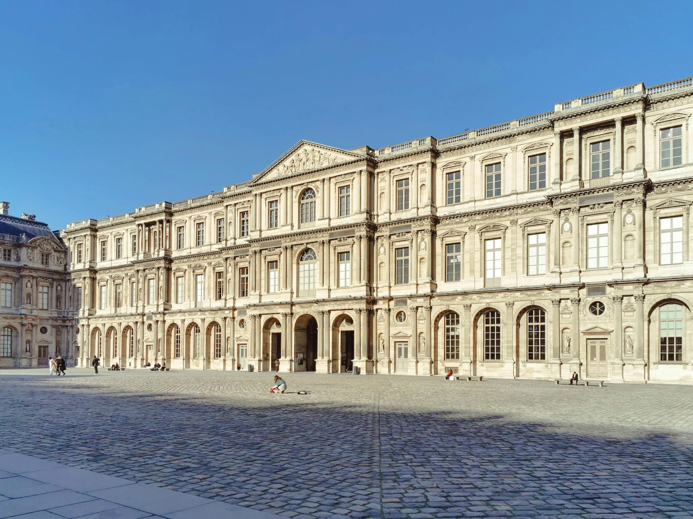 there is an older mansion on a corner in the square