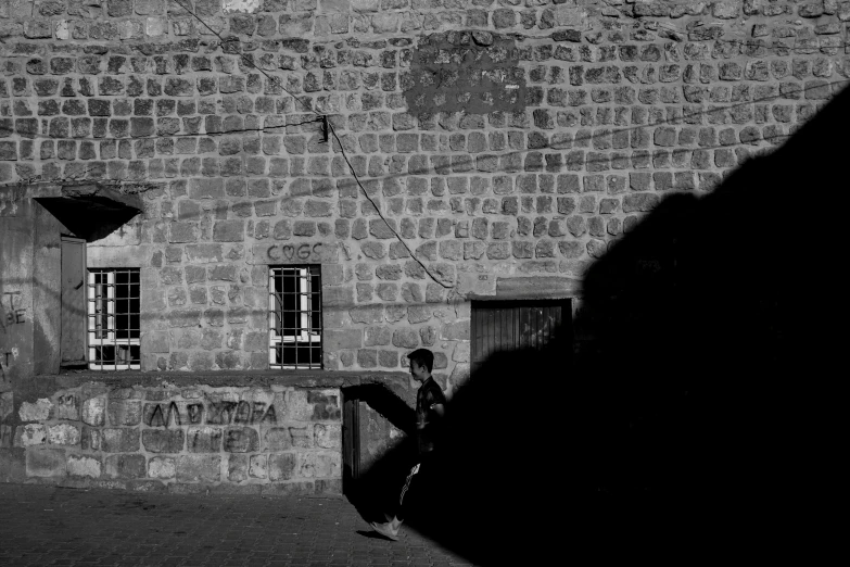 a man is on a street corner by a building