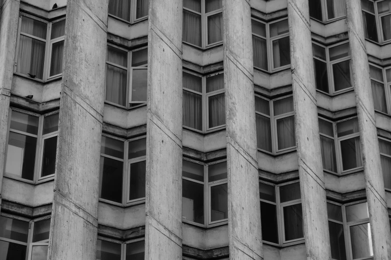 many windows in the side of an office building