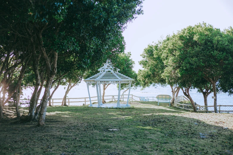 a view of a gazebo in the middle of the grass