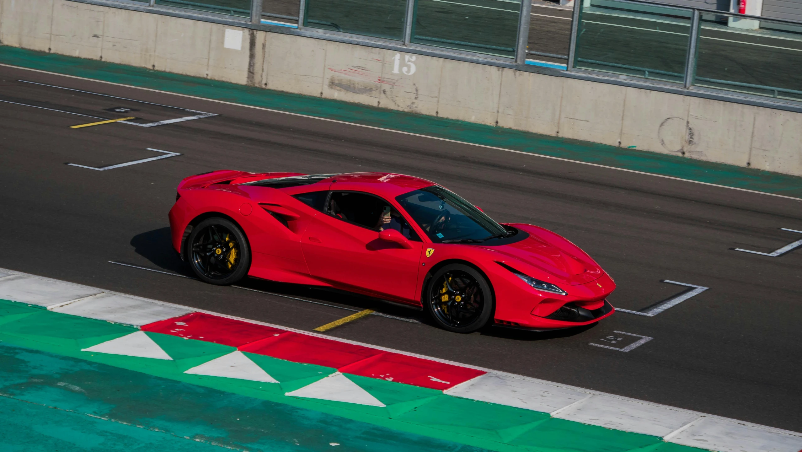 the front end of a ferrari sports car in a race track