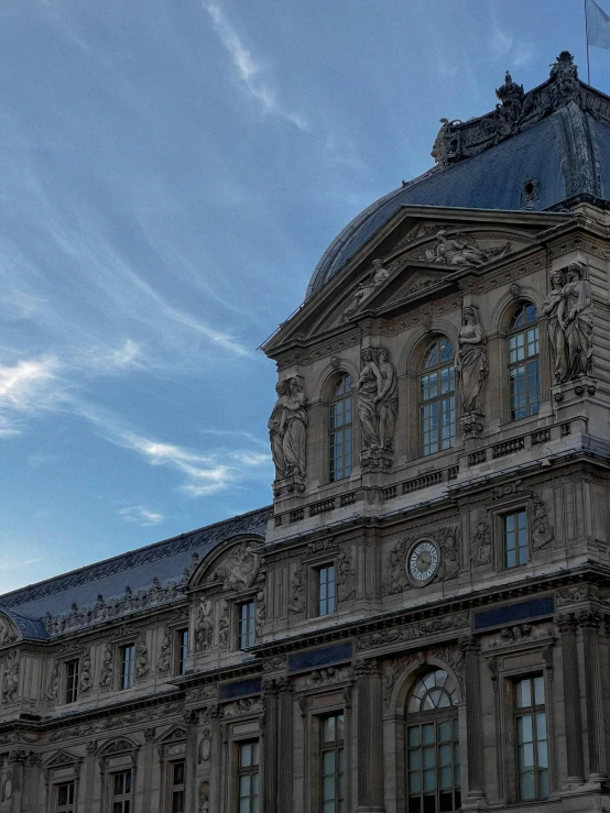 a building with two balconies and blue sky