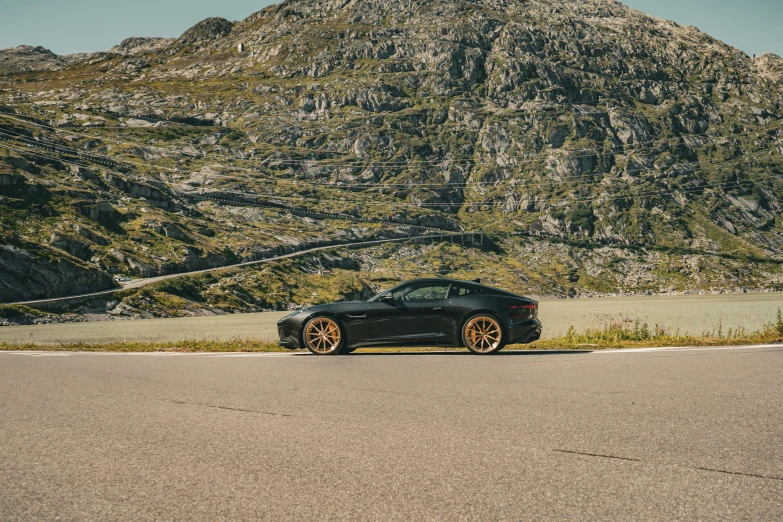 a car that is parked by a hill