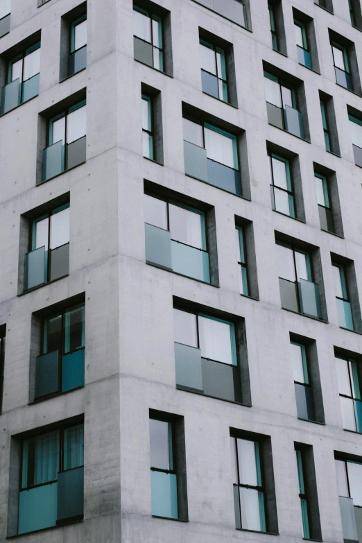 the view from outside looking up at a tall building