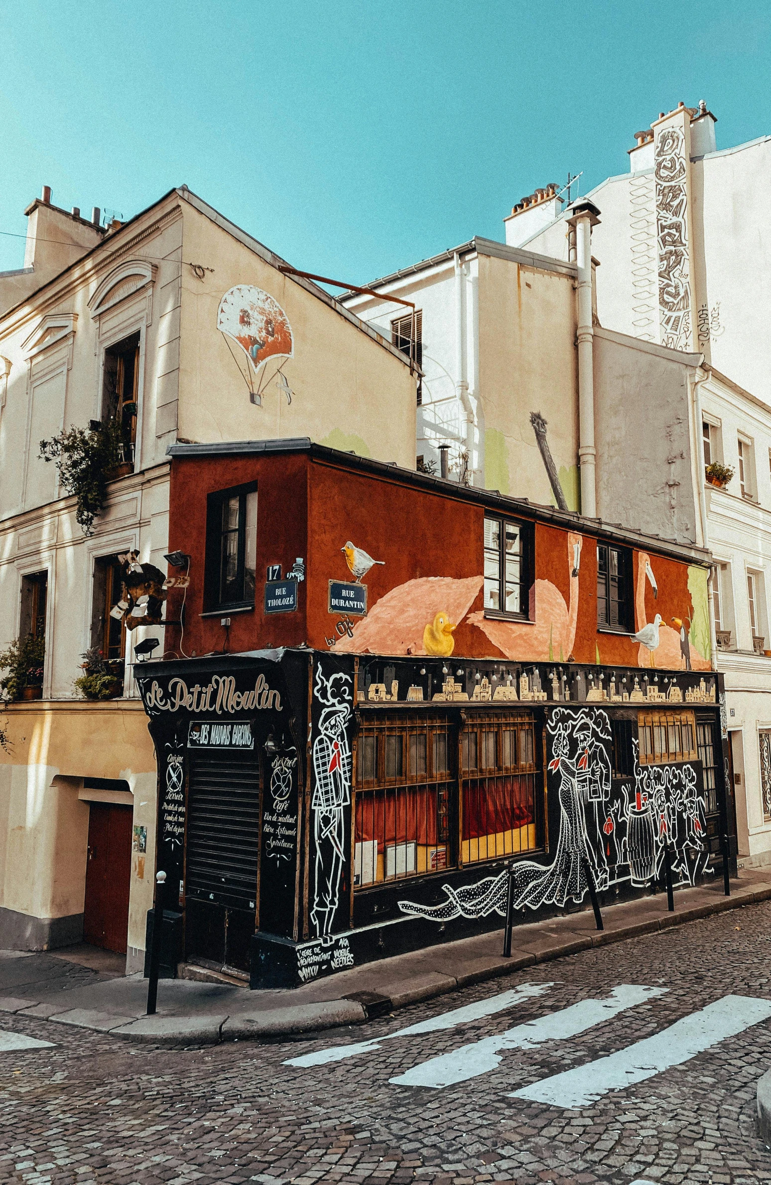 street view of building with graffiti covering windows