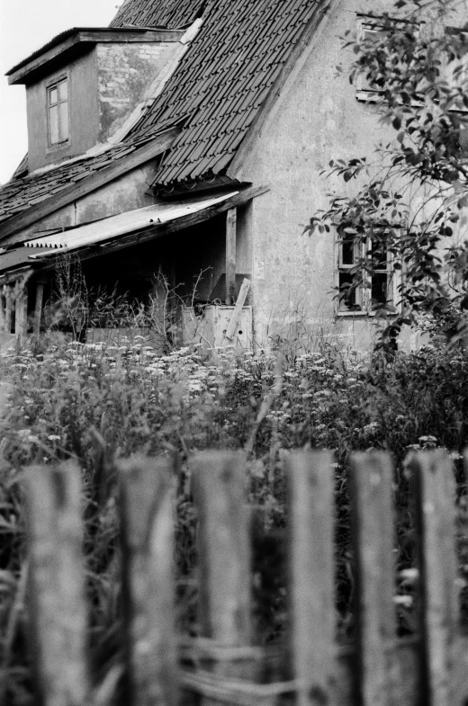 an old building with a lot of grass in front of it