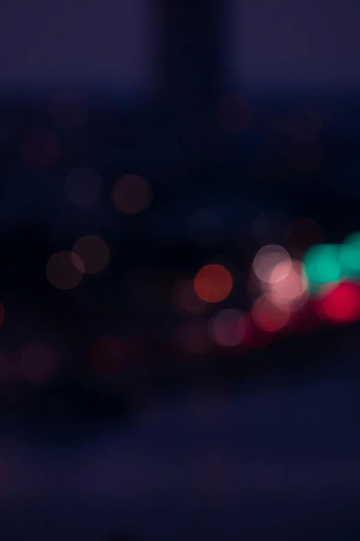 an abstract image shows blurry lights on a city street