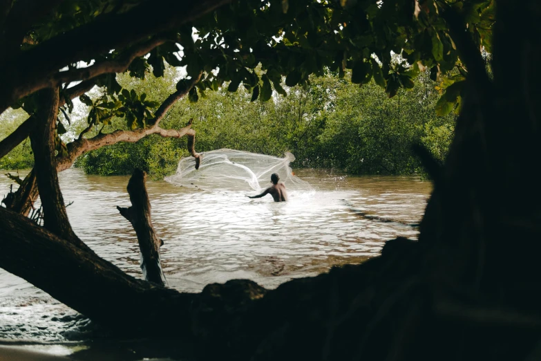 people who are wading through some water