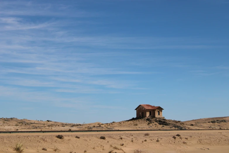 a house in the middle of a desert