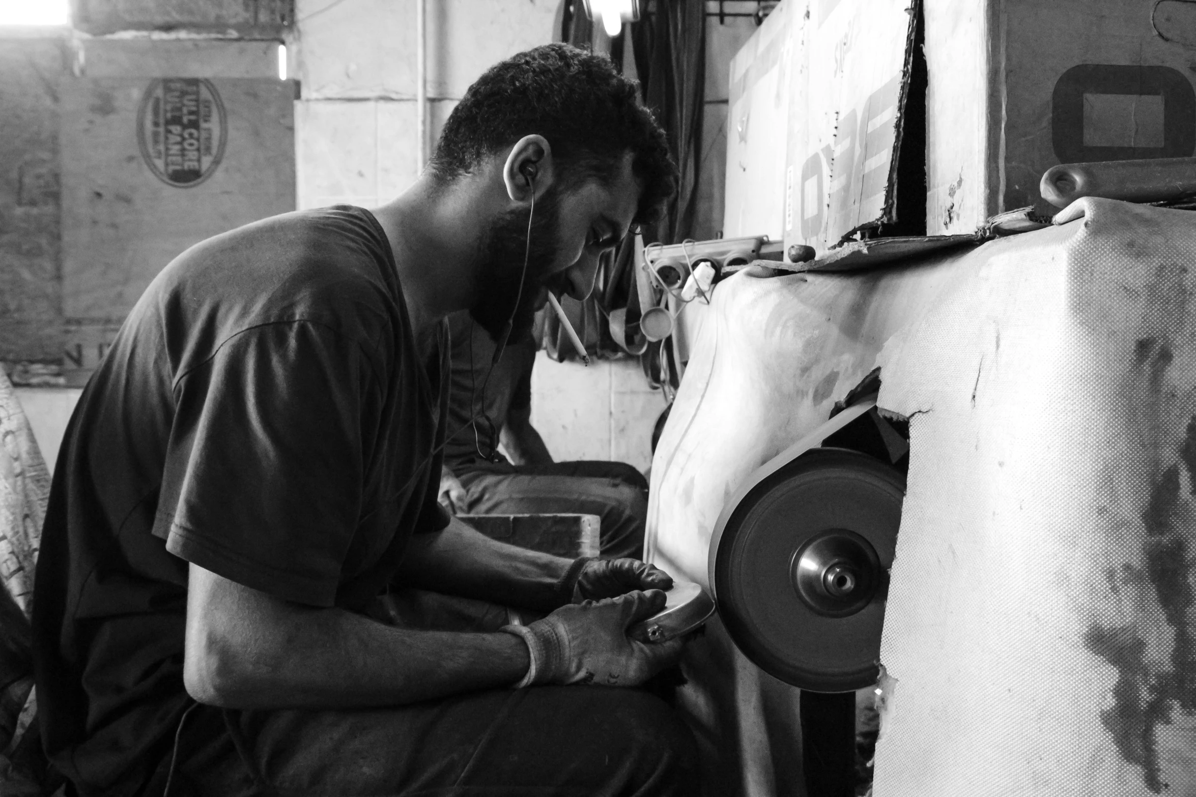 man at a printing machine working on some items