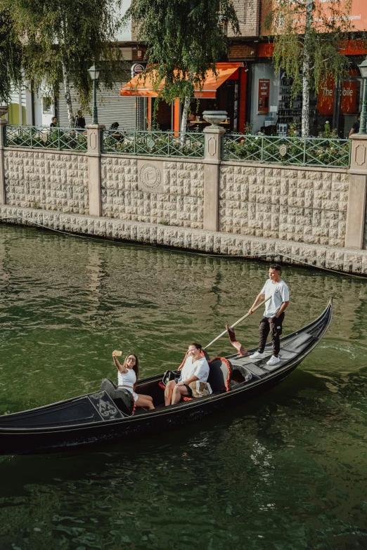 a person riding on a boat down a river