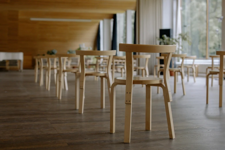 rows of chairs arranged on the floor in an empty restaurant