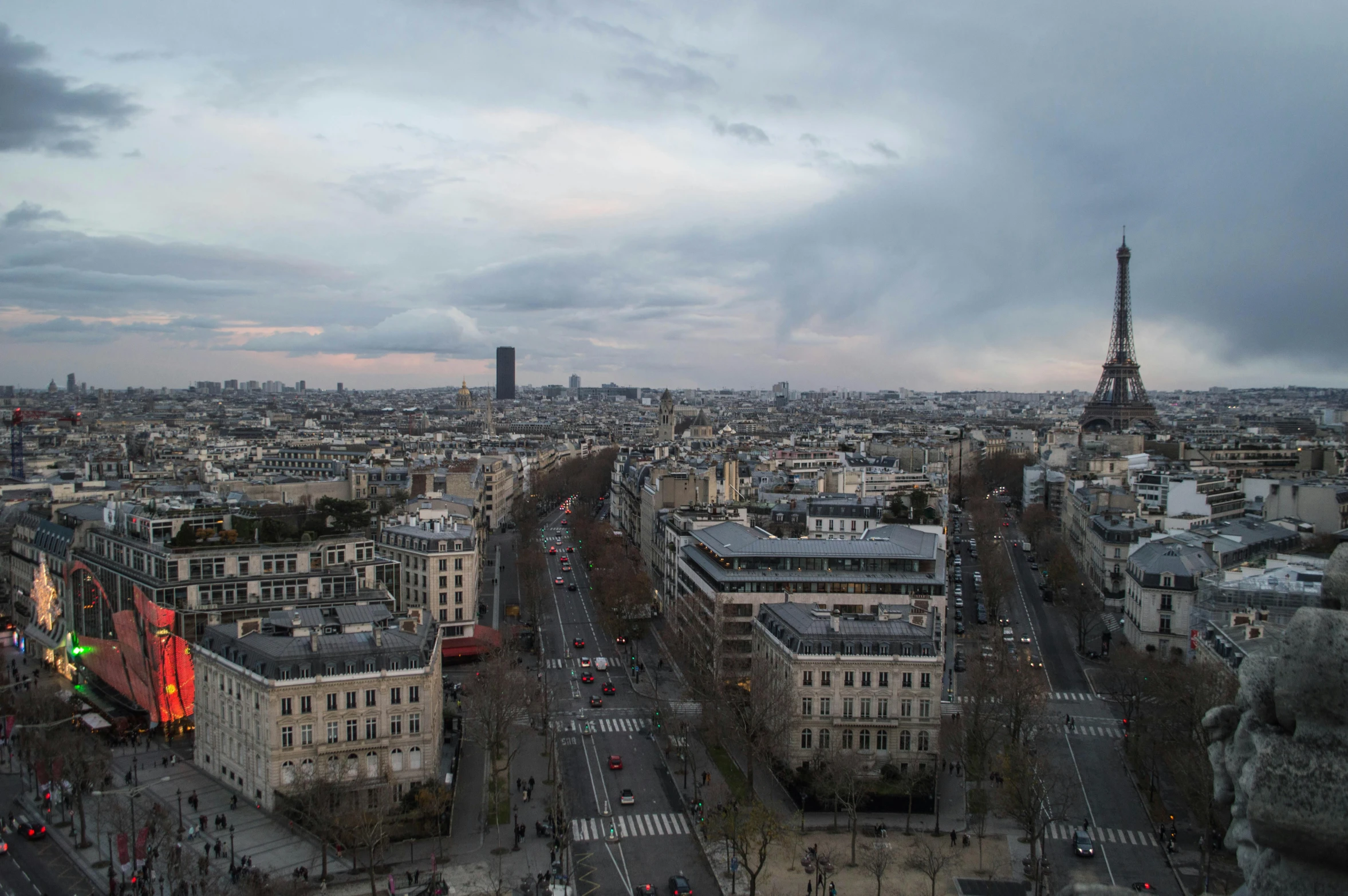 a city skyline with the eiffel tower towering over the city