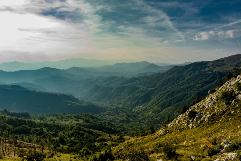 the view from a hill top in the mountains