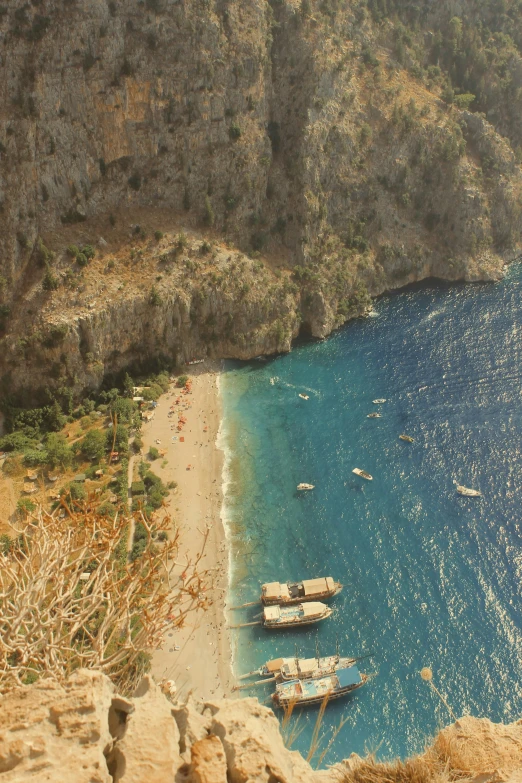 several sail boats docked in a body of water