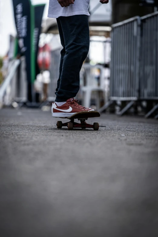 a close up of the feet of a person riding a skateboard