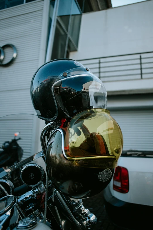 a helmet on the back of a motorcycle