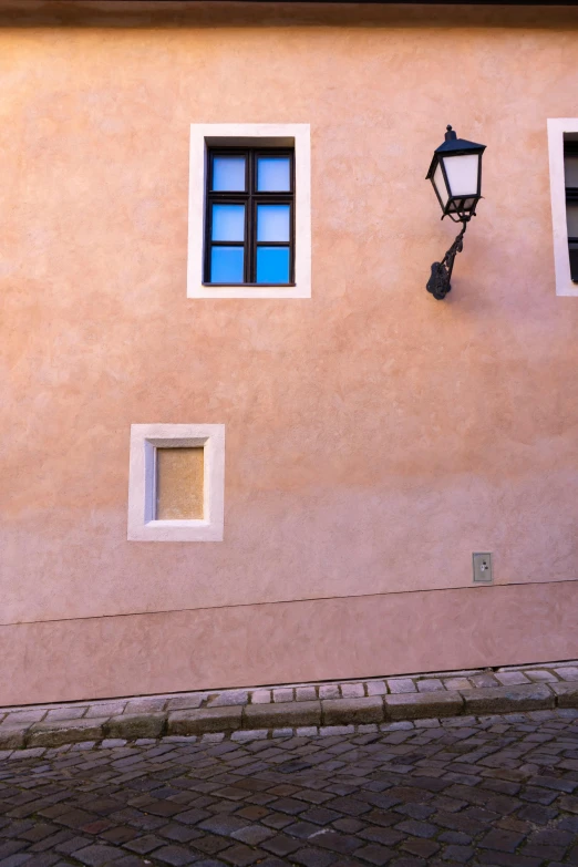 the window on the building has the same amount of light coming from the windows